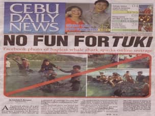 Newspaper article about animal abuse in Oslob